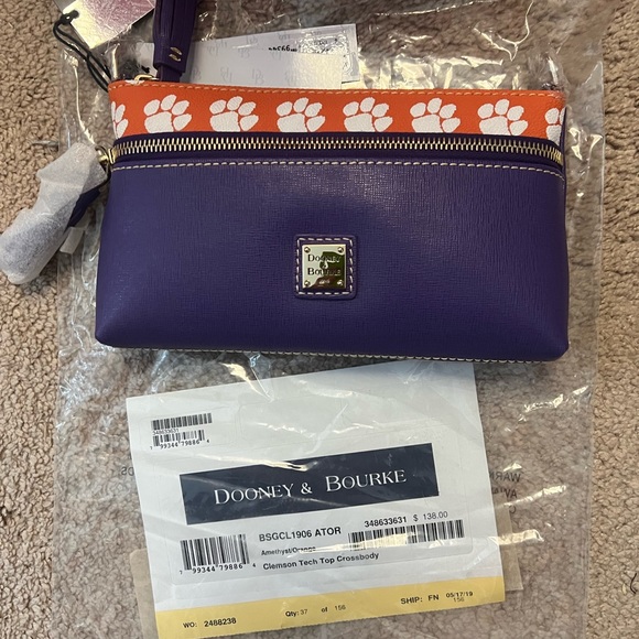 New Dooney and Bourke crossbody bag. Never used, has papers. - Picture 2 of 2